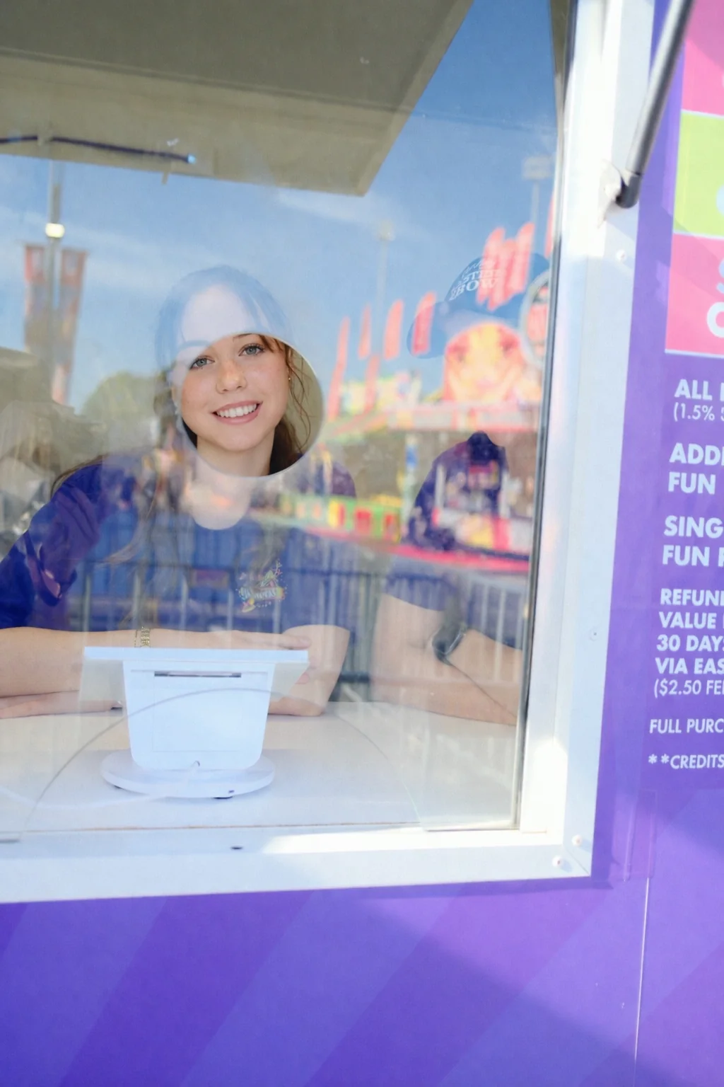 Sydney Royal Easter Show team member behind a Fun Pass kiosk window
